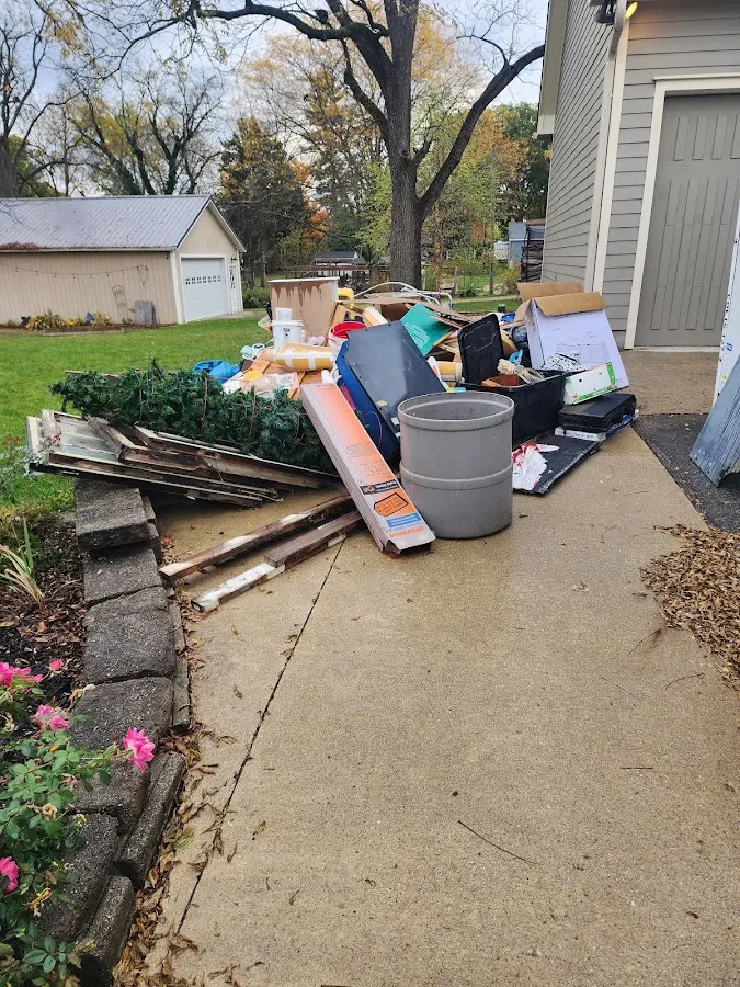 Dumpster being loaded with debris for 3 Yard Dumpster Rental in Ocean City